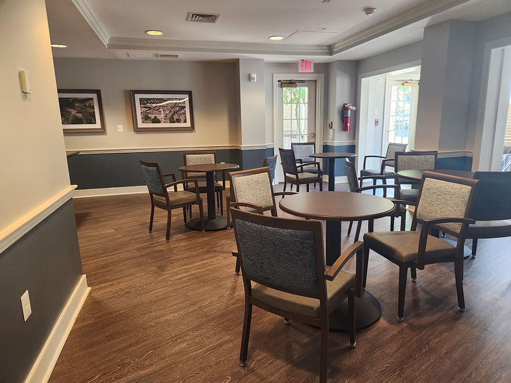 dining area with multiple tables and chairs