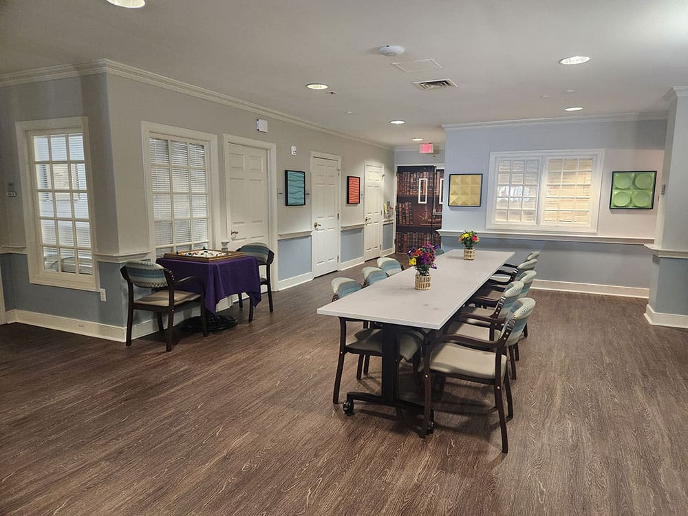 large room with tables, art and games