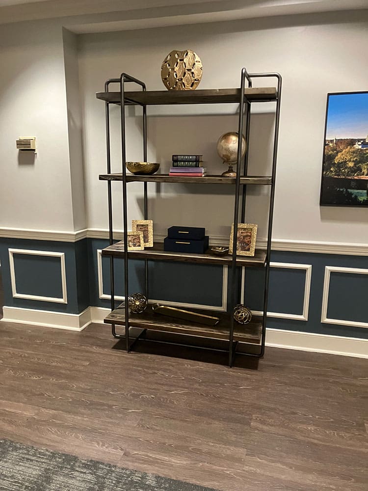 display shelf with art, pictures and books